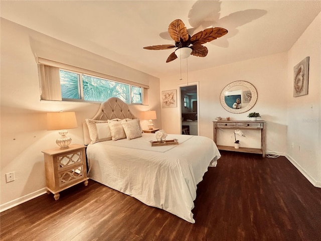 bedroom with dark wood-type flooring, connected bathroom, ceiling fan, and baseboards