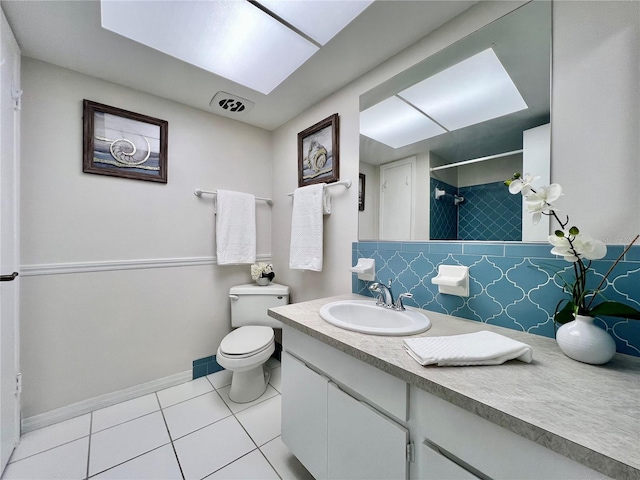 full bath featuring toilet, visible vents, vanity, tile patterned floors, and walk in shower