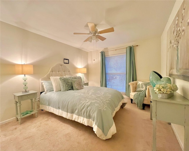 bedroom featuring light colored carpet, ceiling fan, and baseboards