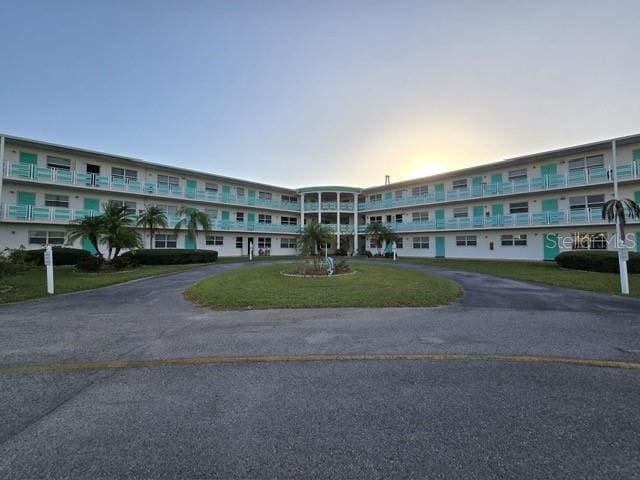 view of outdoor building at dusk