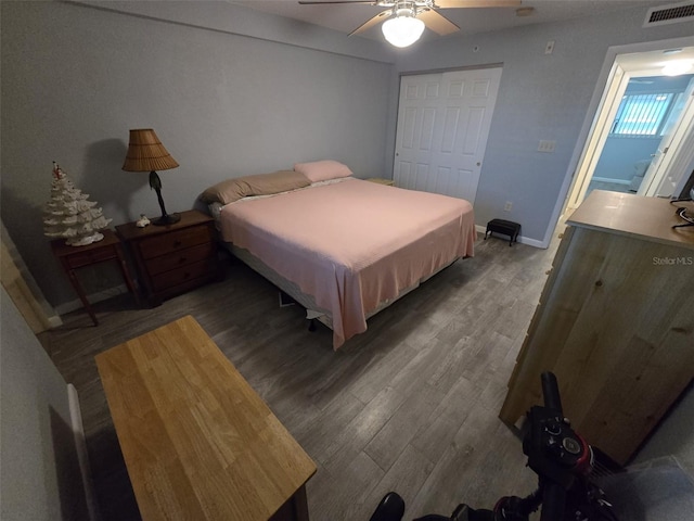 bedroom featuring hardwood / wood-style floors, a closet, and ceiling fan