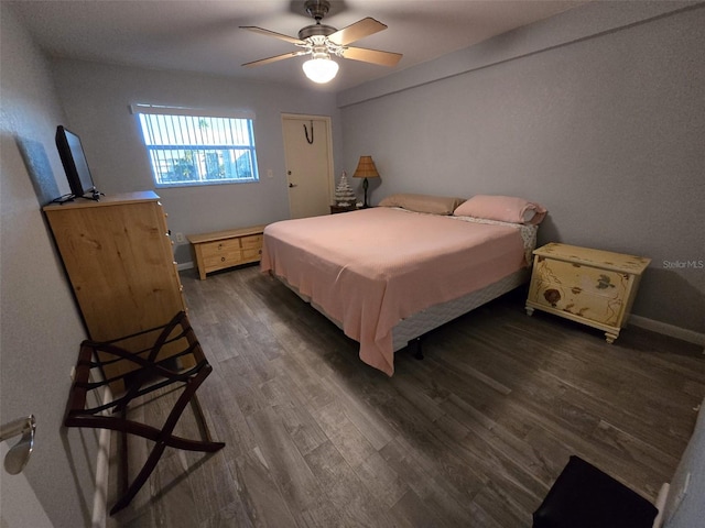 bedroom featuring dark hardwood / wood-style floors and ceiling fan