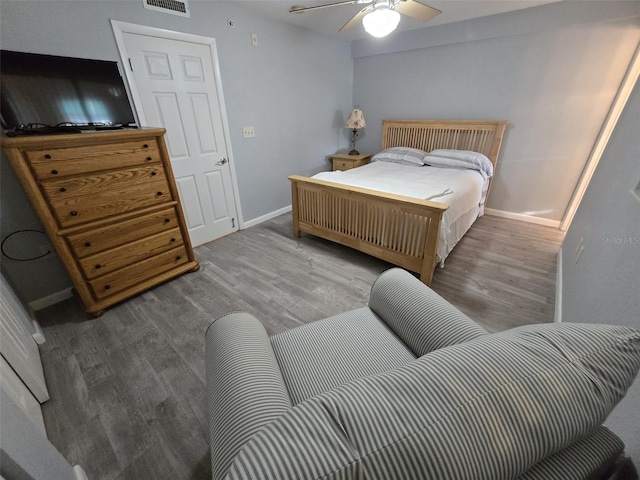 bedroom with hardwood / wood-style floors