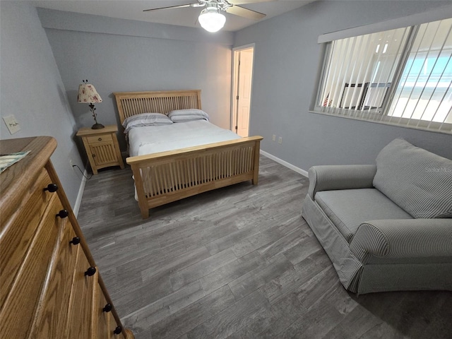 bedroom with dark wood-type flooring and ceiling fan