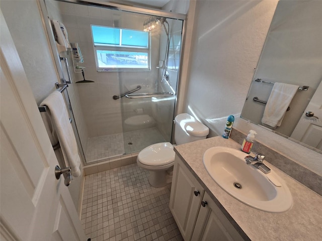 bathroom with vanity, tile patterned flooring, toilet, and an enclosed shower