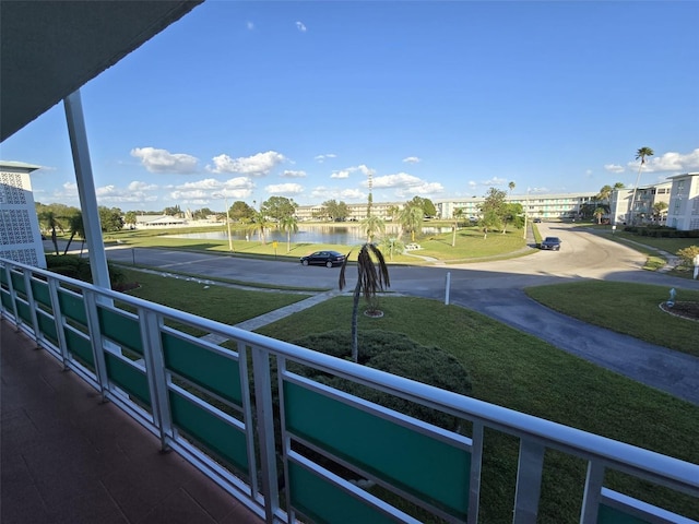 balcony featuring a water view