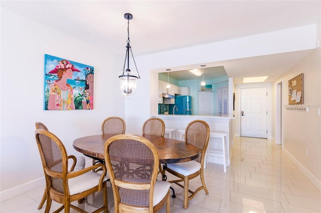 16500 Gulf Blvd Unit 352, North Redington Beach, FL 33708 - dining area with baseboards and light tile patterned floors
