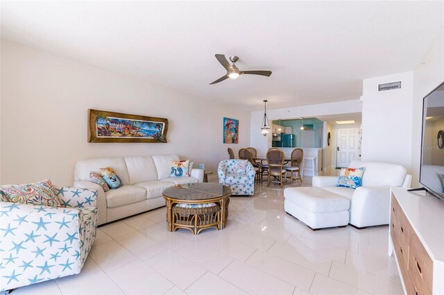 16500 Gulf Blvd Unit 352, North Redington Beach, FL 33708 - living room featuring a ceiling fan and light tile patterned floors