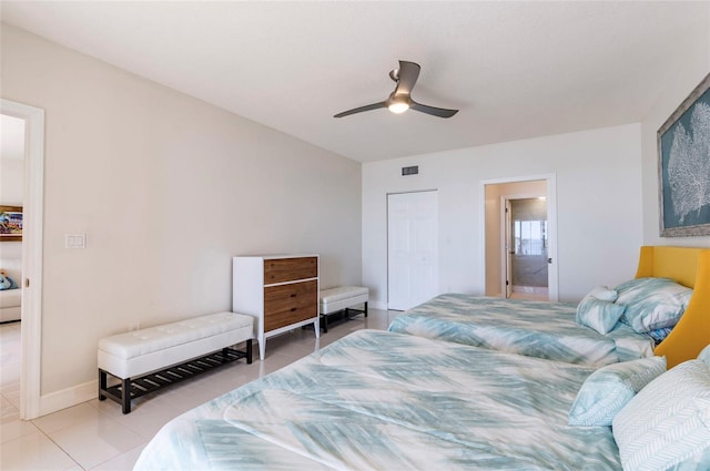 16500 Gulf Blvd Unit 352, North Redington Beach, FL 33708 - bedroom featuring tile patterned floors, a ceiling fan, baseboards, and ensuite bath