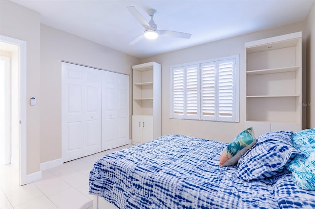 16500 Gulf Blvd Unit 352, North Redington Beach, FL 33708 - bedroom with tile patterned floors, a closet, a ceiling fan, and baseboards