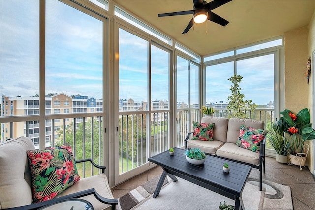 sunroom featuring plenty of natural light and ceiling fan