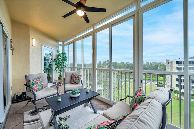 sunroom / solarium with ceiling fan and a healthy amount of sunlight