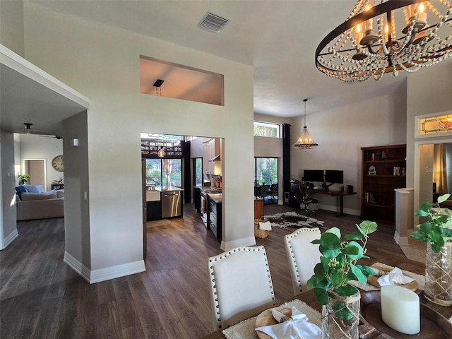 dining space with dark hardwood / wood-style floors