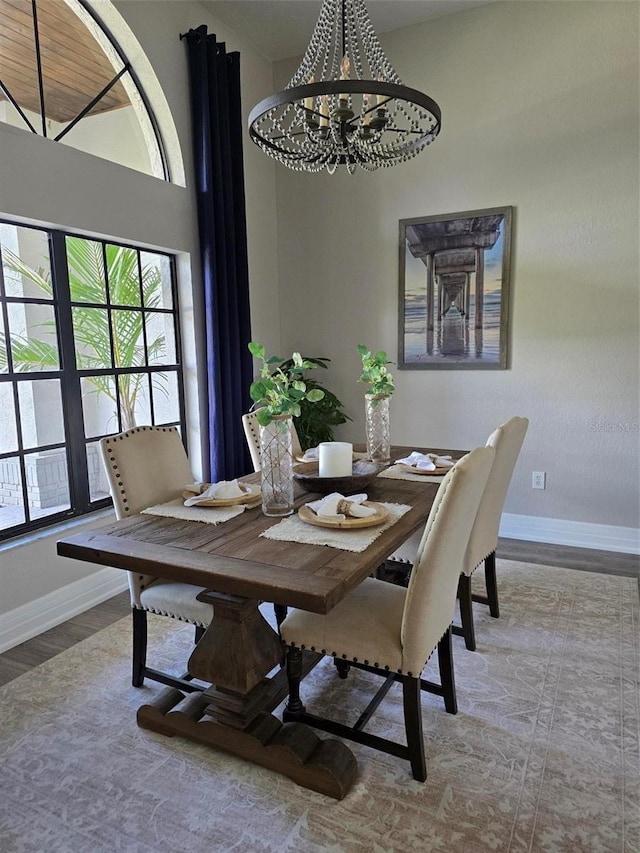 dining room featuring an inviting chandelier and light hardwood / wood-style flooring