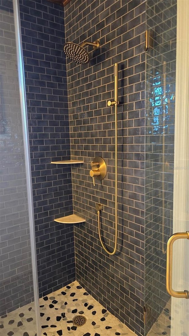 bathroom featuring an enclosed shower