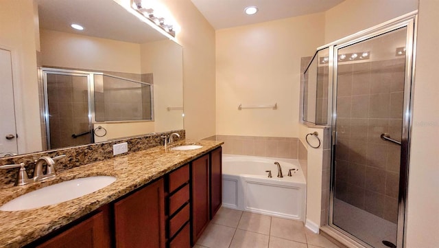 bathroom with tile patterned flooring, vanity, and plus walk in shower