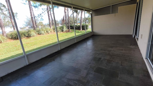 unfurnished sunroom featuring a healthy amount of sunlight