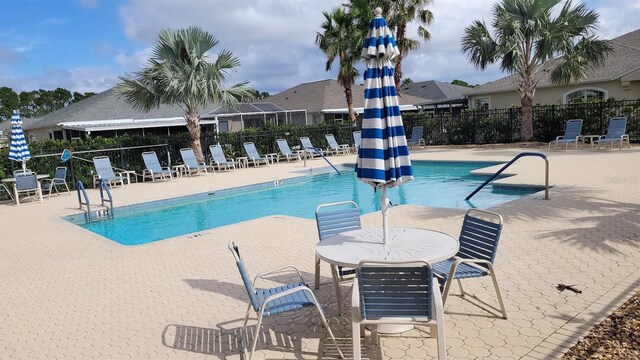 view of swimming pool featuring a patio