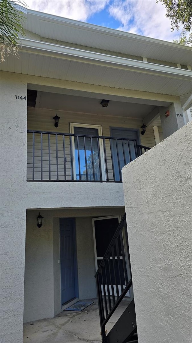 property entrance with a balcony