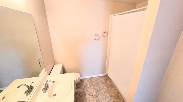 bathroom with sink and toilet