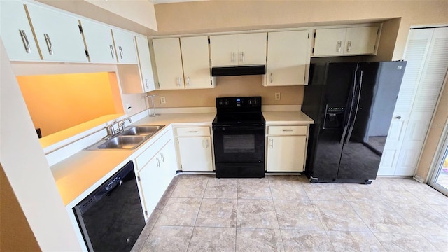 kitchen featuring light tile patterned floors, sink, and black appliances