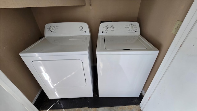 laundry room with independent washer and dryer