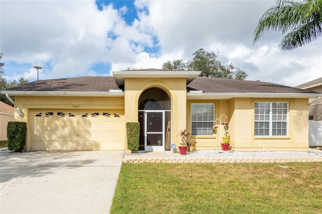 24617 Laurel Ridge Dr, Lutz, FL 33559 - view of front of property featuring stucco siding, an attached garage, concrete driveway, a front lawn, and a shingled roof