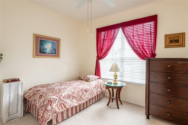 24617 Laurel Ridge Dr, Lutz, FL 33559 - bedroom featuring light carpet, a ceiling fan, and baseboards
