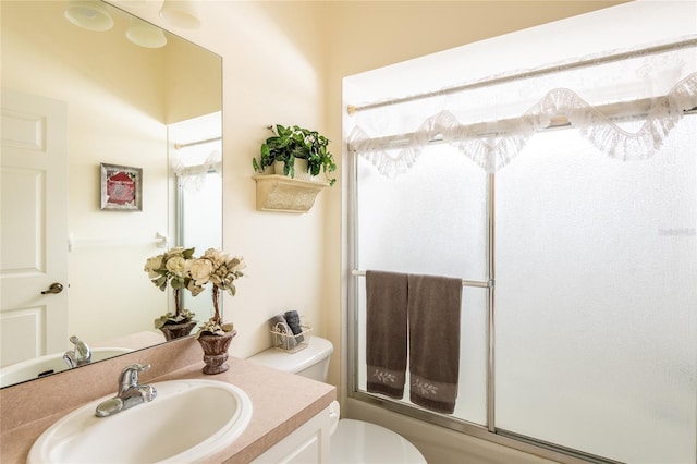 24617 Laurel Ridge Dr, Lutz, FL 33559 - bathroom with vanity, toilet, and bath / shower combo with glass door
