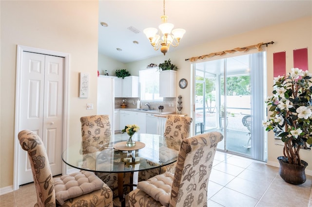 24617 Laurel Ridge Dr, Lutz, FL 33559 - dining room with a chandelier, light tile patterned floors, and baseboards