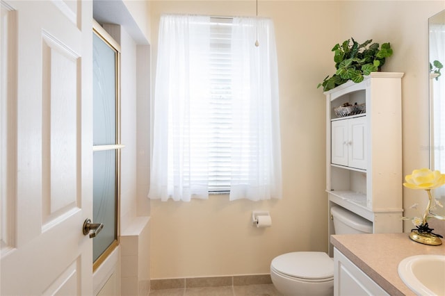 24617 Laurel Ridge Dr, Lutz, FL 33559 - full bath with toilet, vanity, tile patterned floors, and baseboards