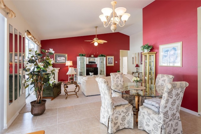 24617 Laurel Ridge Dr, Lutz, FL 33559 - tiled dining room with lofted ceiling, a ceiling fan, a chandelier, and baseboards