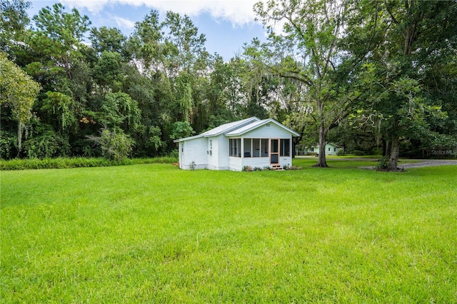 view of yard with a sunroom