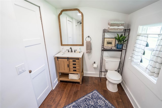 bathroom featuring hardwood / wood-style floors, vanity, and toilet