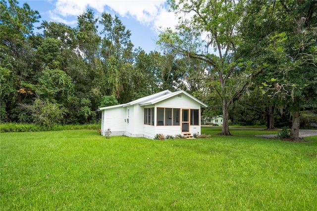 view of yard featuring a sunroom