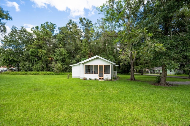 view of yard featuring a sunroom