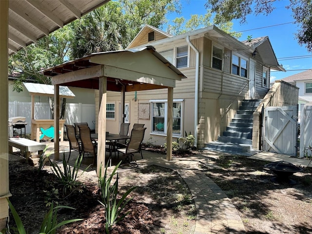 rear view of property featuring a patio area