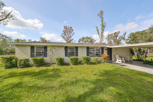 single story home with a front yard and a patio