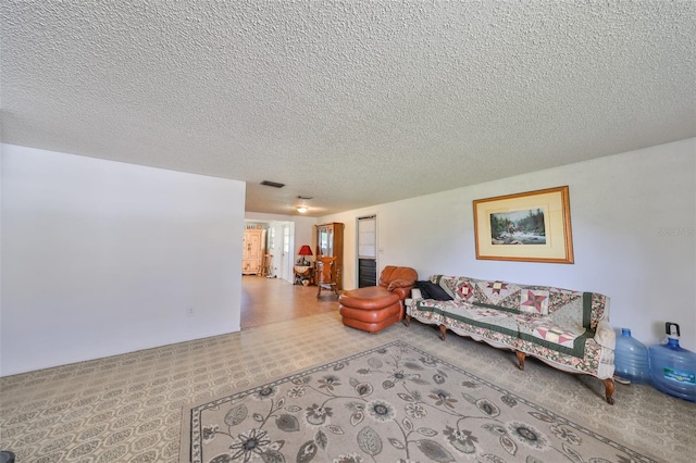 living room featuring a textured ceiling