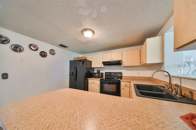 kitchen with sink, black appliances, kitchen peninsula, light brown cabinets, and a textured ceiling