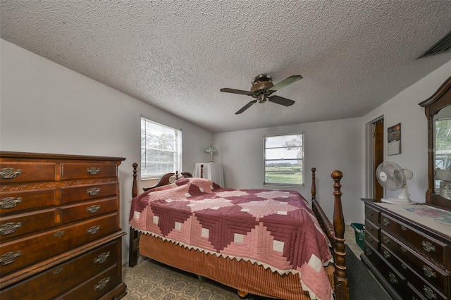 bedroom featuring a textured ceiling and ceiling fan