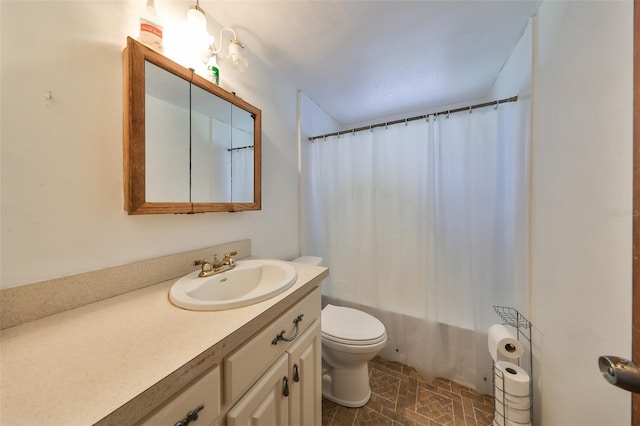 bathroom with toilet and vanity