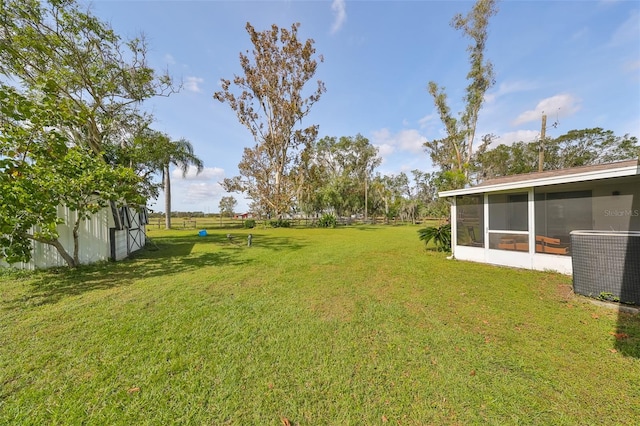 view of yard featuring a sunroom