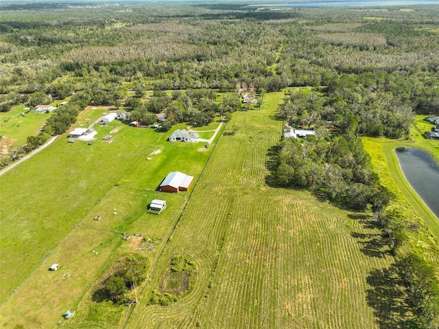 drone / aerial view featuring a water view and a rural view