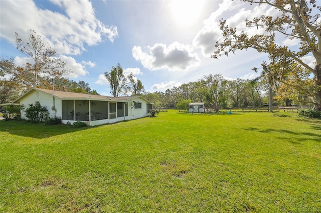 view of yard with a sunroom