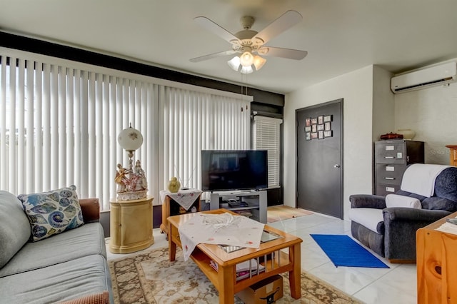 living room with ceiling fan, light tile patterned floors, and a wall unit AC