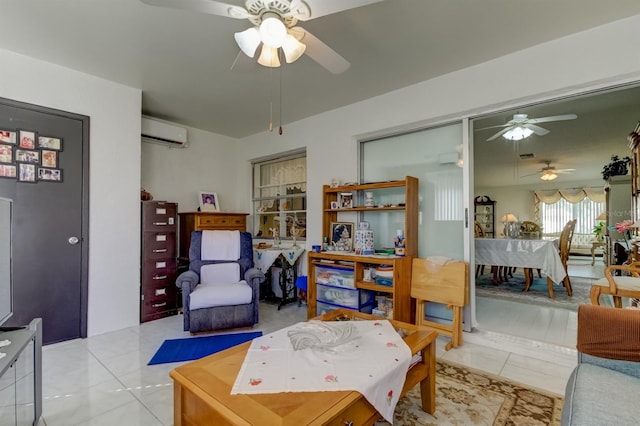 living room with a wall mounted air conditioner, ceiling fan, and light tile patterned floors