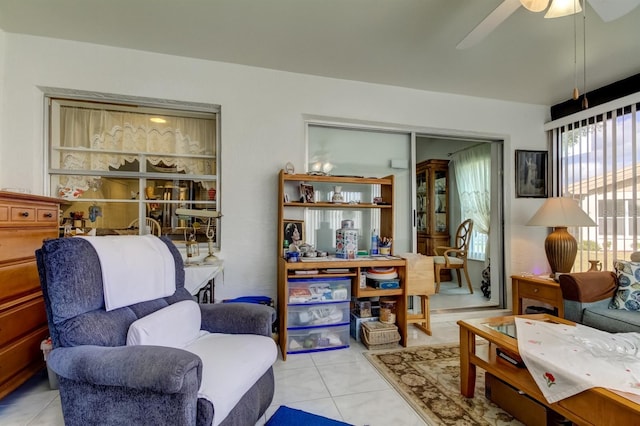 sitting room featuring ceiling fan and light tile patterned flooring