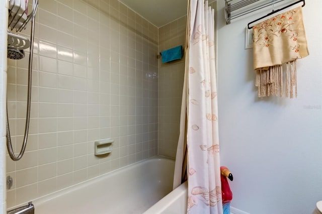 bathroom with shower / tub combo with curtain