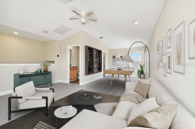 living room featuring ceiling fan, vaulted ceiling, and carpet floors